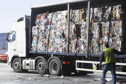 Waste removal trucks and equipment on a building site