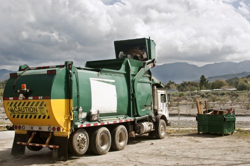 Technician assessing waste with clipboard for free quote